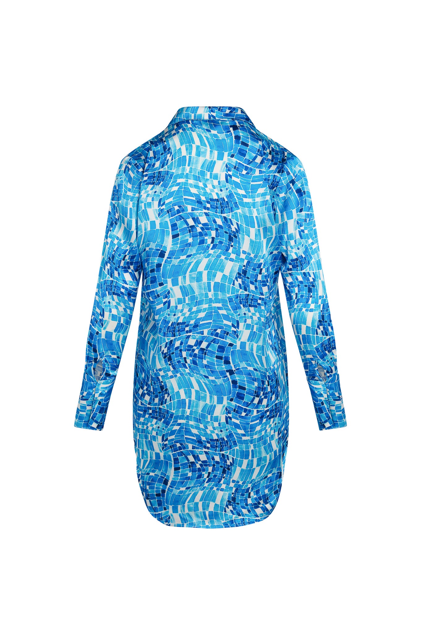 Back-view of a Catherine Gee Daria Shirt Pool Mosaic dress features a vibrant blue mosaic pattern reminiscent of a swimming pool, with various shades of blue and white creating a dynamic, wavy design. It has long sleeves and a high collar, with a slightly curved hemline at the bottom. The complex pattern and the unique color scheme make this dress visually striking and stylish.