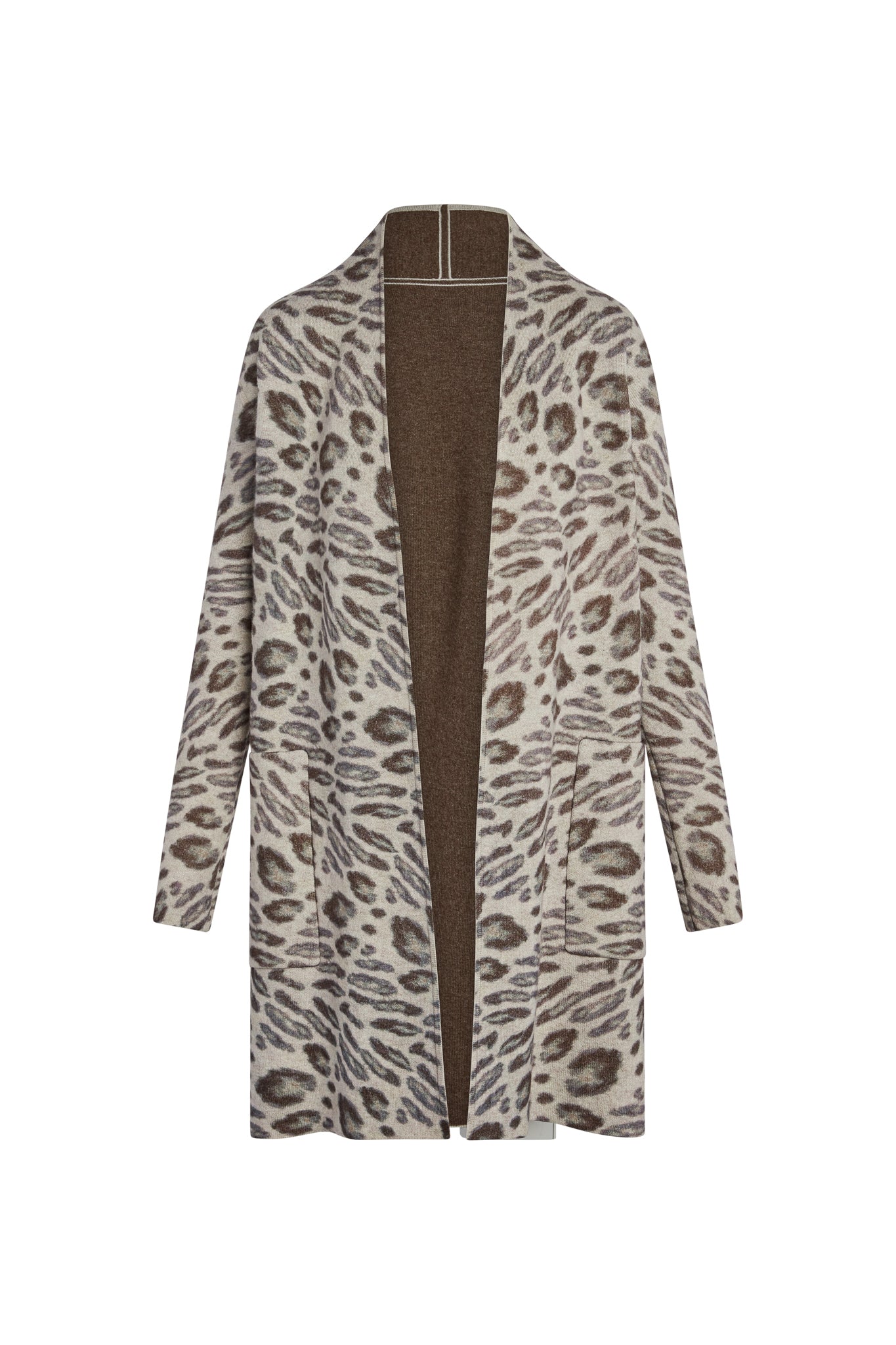 Catherine Gee Double Face Cashmere Reversible New Leopard Coat. This luxurious coat features a stylish leopard print pattern on one side and a solid brown color on the reverse, offering versatility in wear, has a long, open-front design with a relaxed fit, making it both fashionable and comfortable. The high-quality cashmere material ensures warmth and softness, making it a premium addition to any wardrobe.
