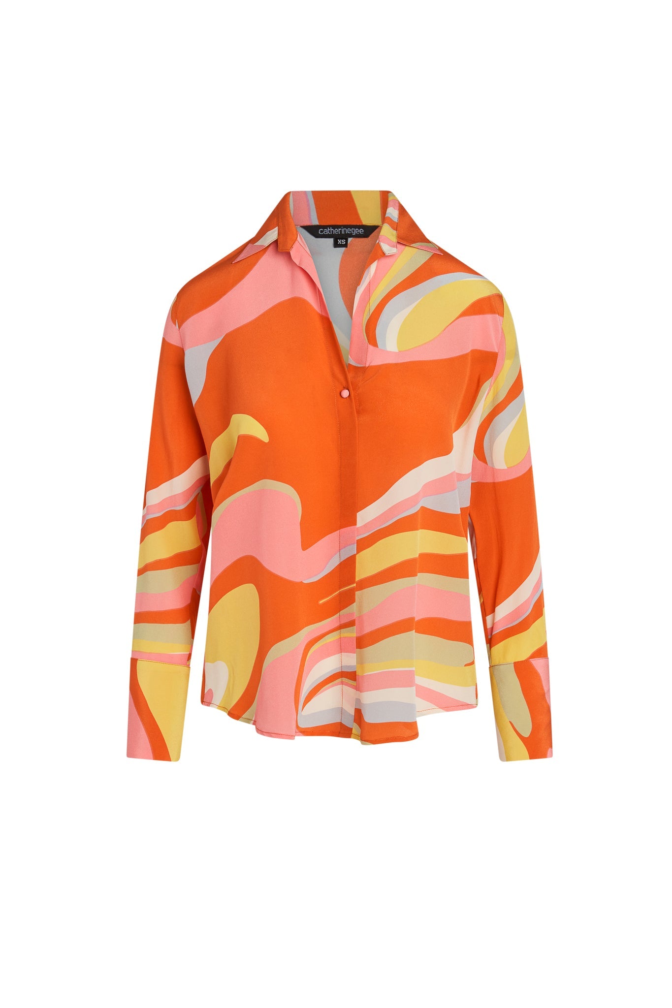 Catherine Gee Daria French Cuff Silk Sherbet blouse features a vibrant, abstract pattern with swirls of orange, pink, yellow, and white. It has a classic collar, a hidden button placket, and long sleeves with French cuffs. The silk material gives it a luxurious and smooth texture, making it a stylish and elegant choice for various occasions.