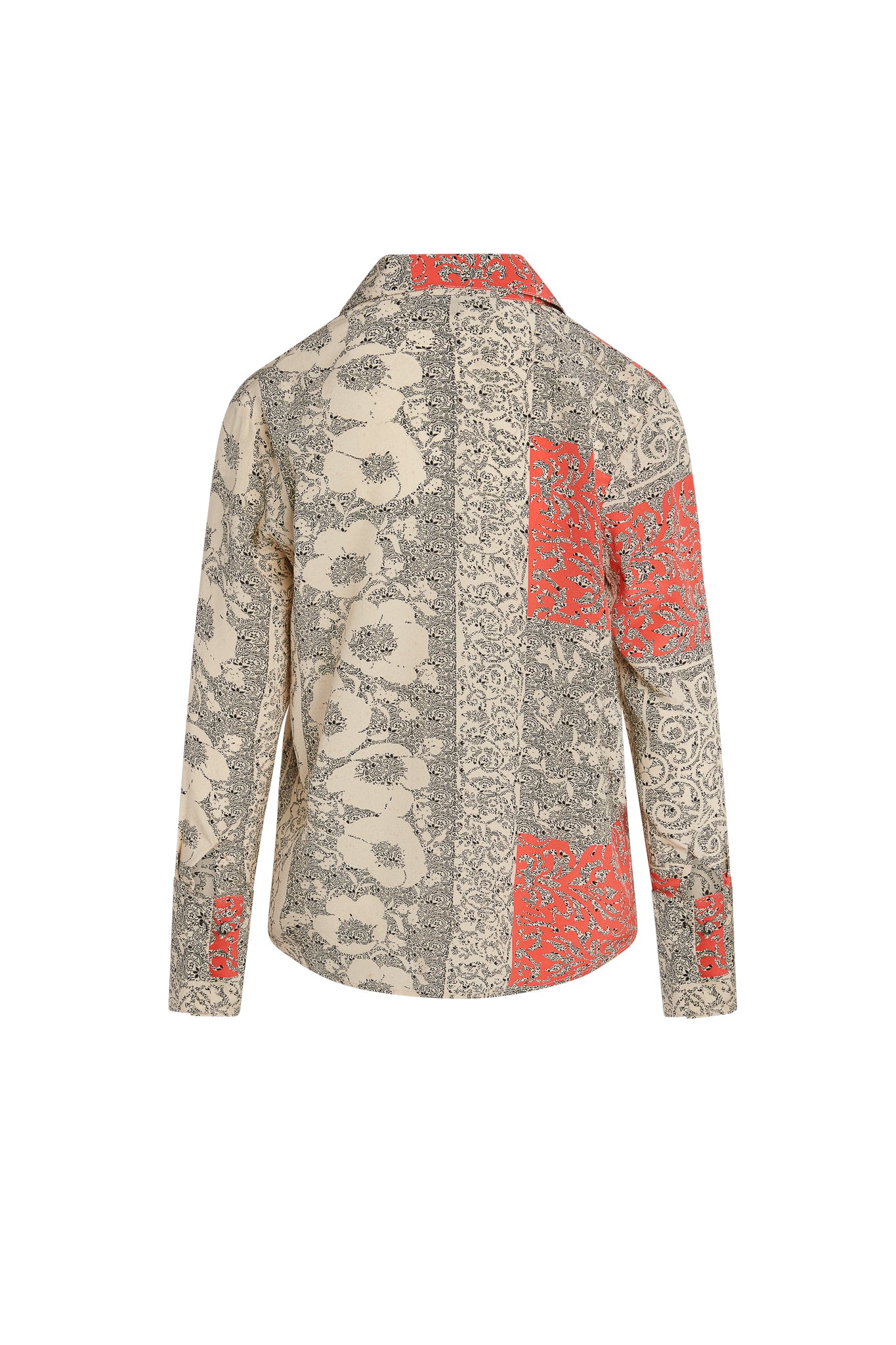 Back-view of a Catherine Gee Daria French Cuff Silk Blouse Capri, featuring a patchwork design with floral and abstract patterns in beige, black, and red colors.
