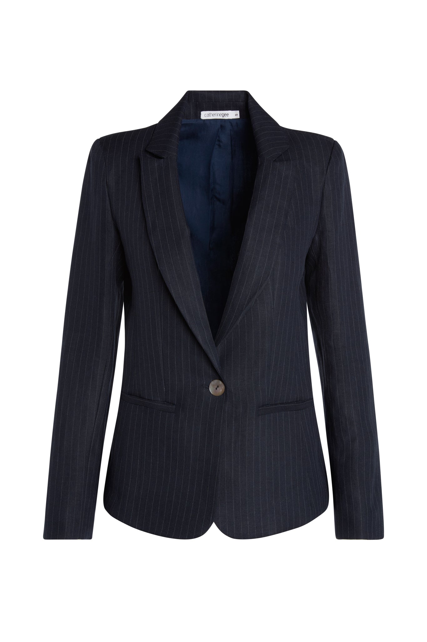 A Catherine Gee Carla Single Button Blazer in dark navy with subtle pinstripes features a notched lapel, a single front button closure, and two front pockets. The interior is lined with a dark fabric, providing a sleek and professional appearance.