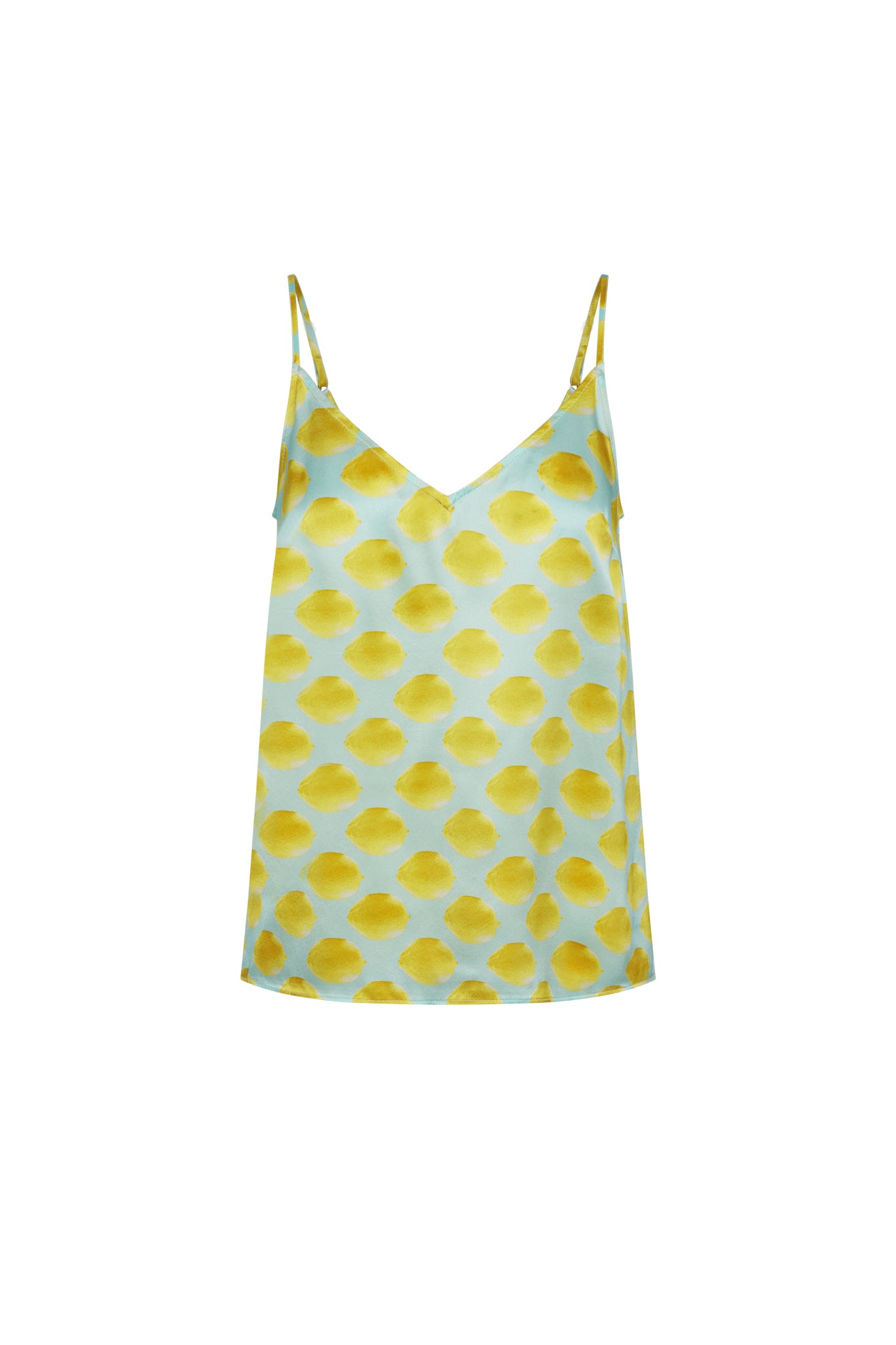 Catherine Gee Franka Cami - Limon Blue features a light blue base adorned with a playful pattern of yellow lemon-like shapes. It has thin spaghetti straps and a V-neckline, giving it a delicate and stylish appearance. The vibrant lemon design and soft blue color make it perfect for a fresh, summery look, adding a cheerful touch to any outfit.
