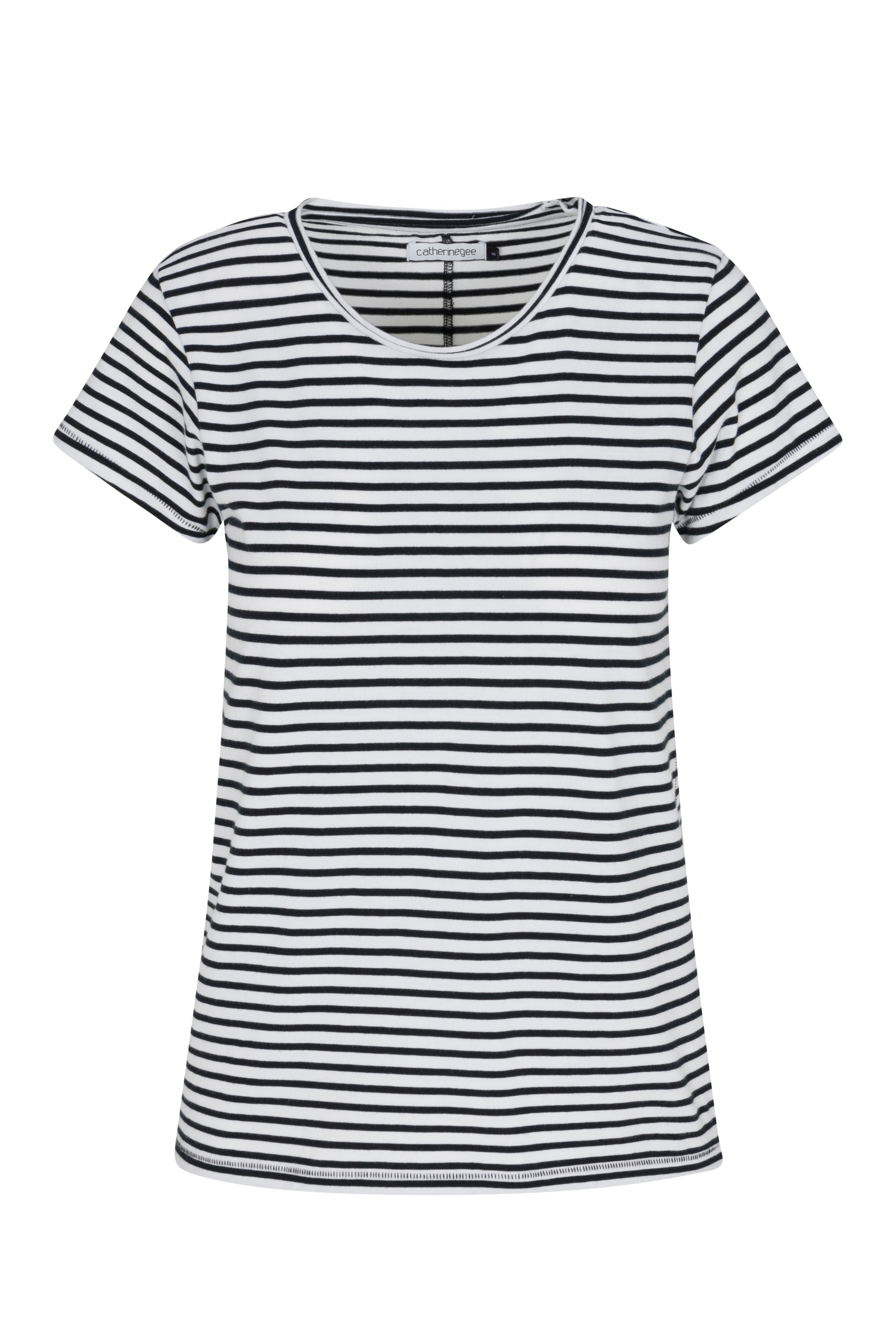 A black and white striped T-shirt by Catherine Gee features horizontal stripes, a round neckline, and short sleeves. The stripes are evenly spaced, creating a classic and timeless look. The fabric appears to be soft and comfortable, suitable for casual wear.