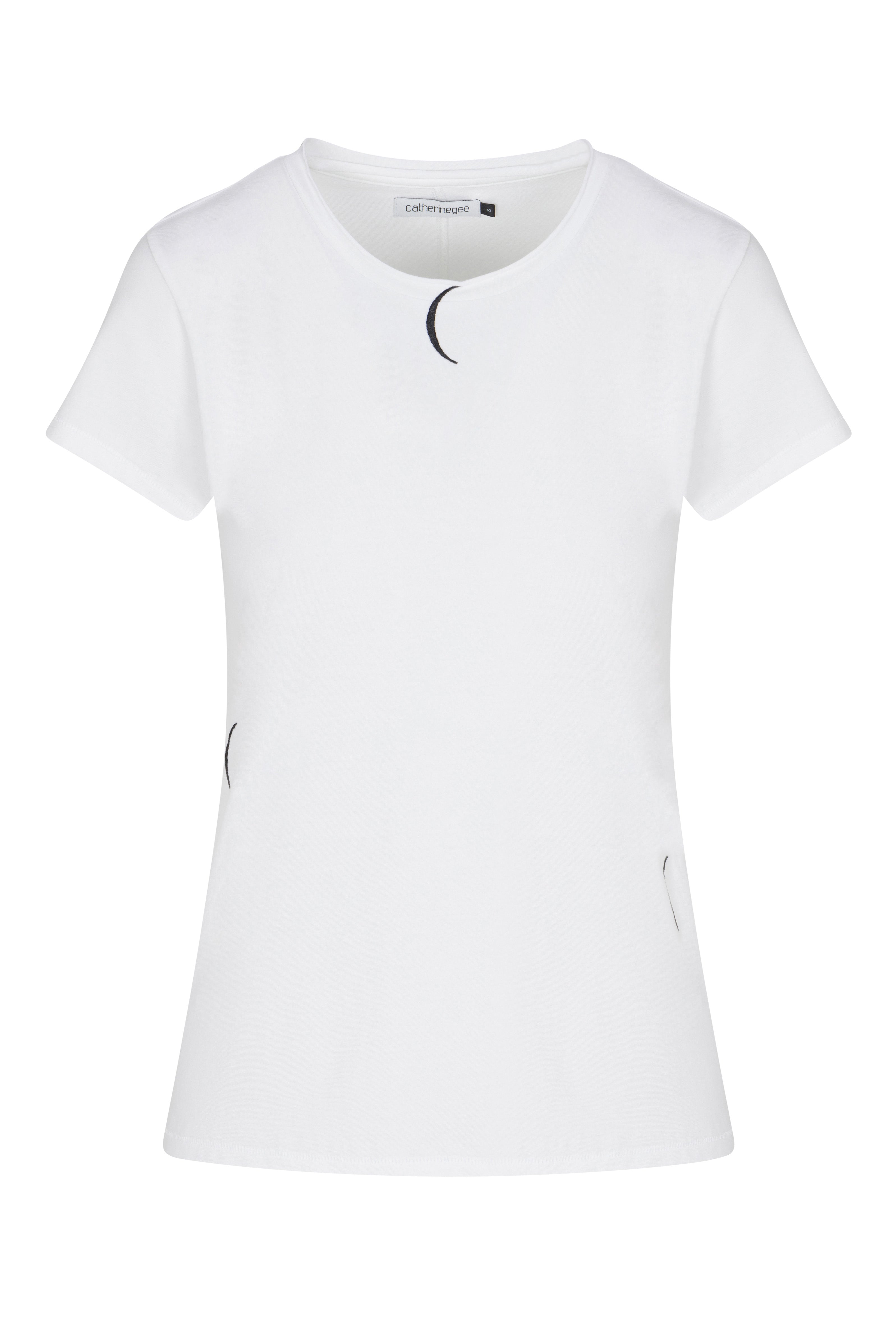 Catherine Gee Embroidered Cotton Crescent white t-shirt showcasing a simple yet elegant design, featuring small crescent moon embroidery details. It has a round neckline and short sleeves, creating a clean and minimalist aesthetic. The subtle crescent moon motifs add a unique touch to the otherwise plain white fabric, making it an interesting choice for casual wear.