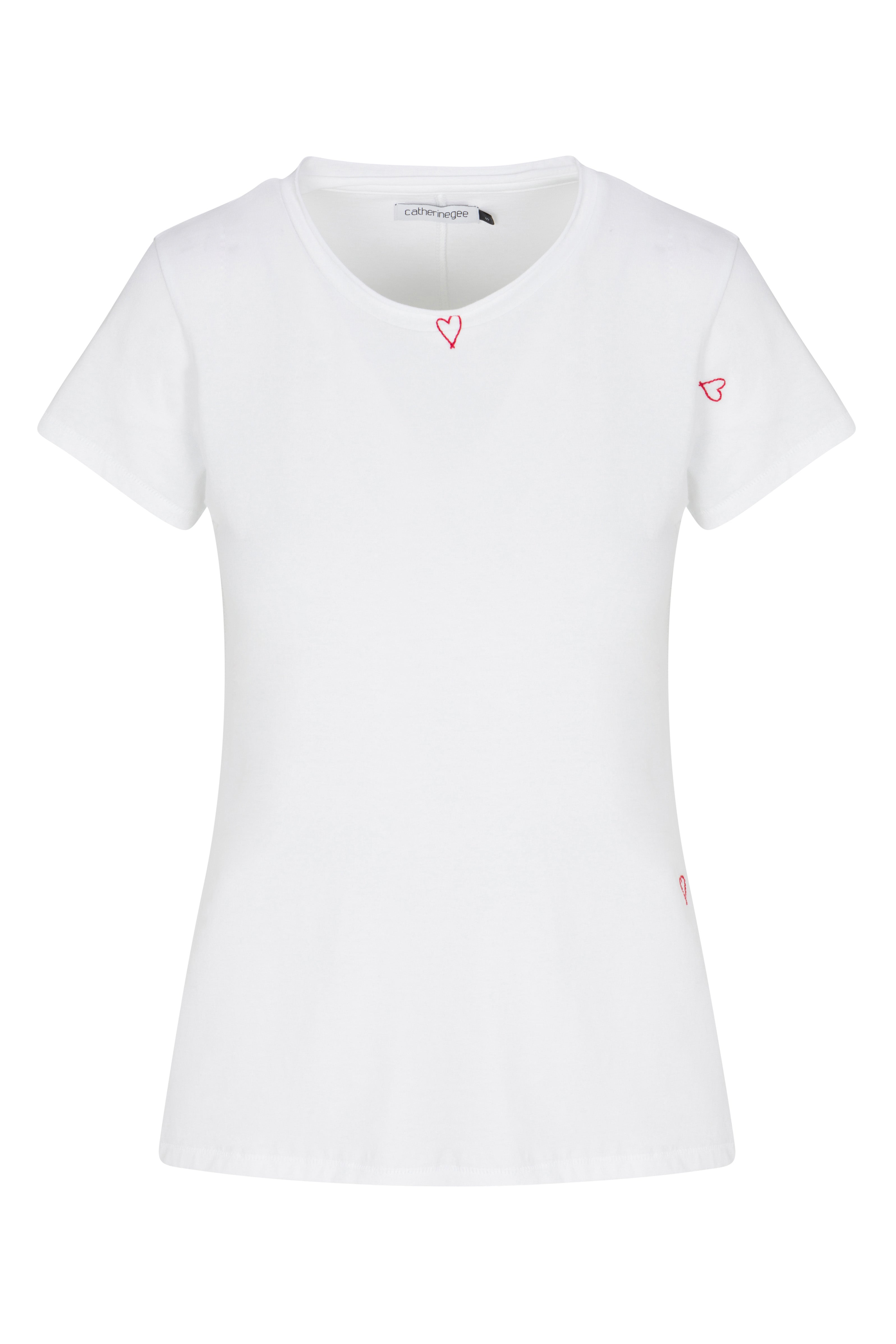 Catherine Gee Embroidered Cotton Red Heart white short-sleeved t-shirt features a simple and elegant design with small red heart embroidery. There are three red heart outlines: one near the neckline, one on the left sleeve, and one near the bottom hem on the right side and has a round neckline and a fitted silhouette, making it a versatile and stylish piece for casual wear.