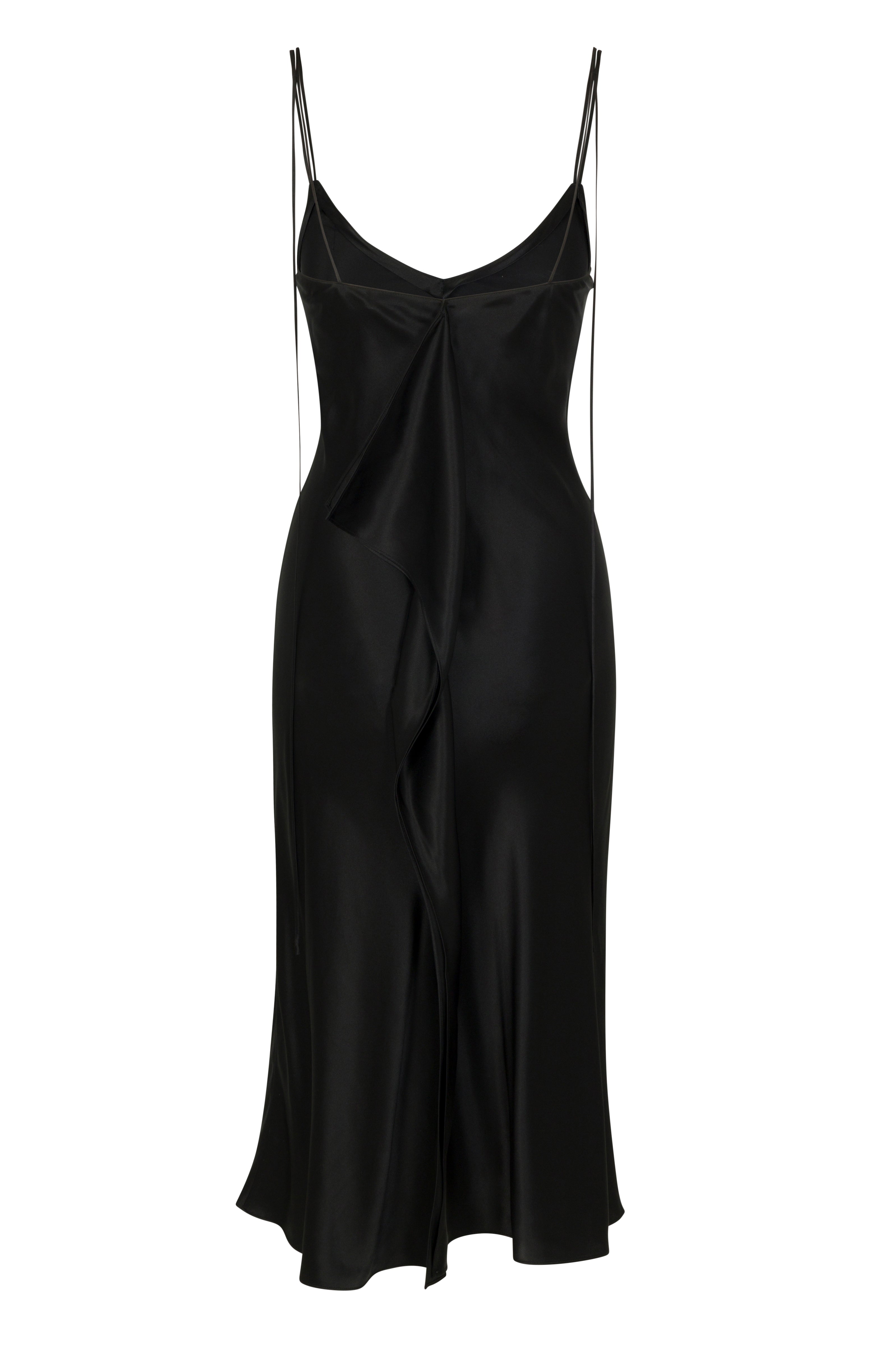 Back-view of Catherine Gee Emma Black Slip Dress. This elegant dress features a sleek, black satin fabric with a subtle sheen. It has thin, delicate spaghetti straps and a deep V-neckline. The dress is designed with a draped front detail that adds a touch of sophistication and movement. The silhouette is fitted through the bodice and hips, flaring slightly towards the hem, creating a flattering and timeless look.