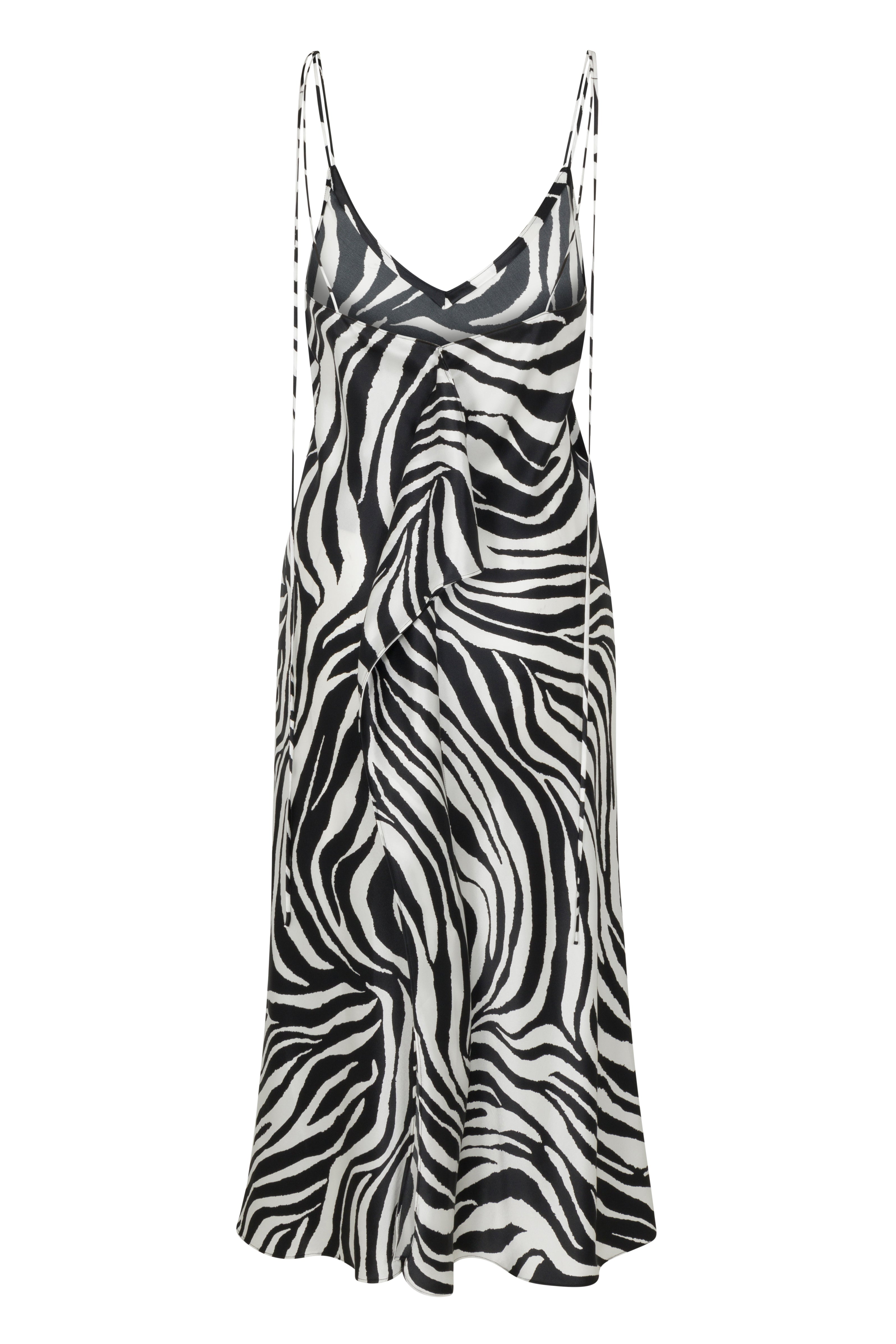 Back-view of Catherine Gee Emma Zebra Slip Dress. This dress features a striking black and white zebra print pattern. It has a V-neckline and thin spaghetti straps, giving it a sleek and elegant look. The dress appears to be made of a lightweight, flowy fabric, which drapes beautifully. The zebra print adds a bold and fashionable touch, making it a standout piece for various occasions.
