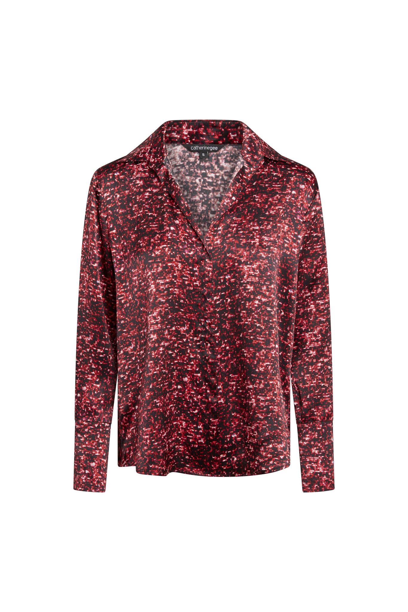 Catherine Gee Daria French Cuff Silk Red Sequin blouse features a vibrant red and black sequin pattern that creates a shimmering effect. It has a classic collar and long sleeves with French cuffs, adding an elegant touch. The silk material gives it a luxurious and smooth texture, making the blouse both stylish and sophisticated, perfect for various occasions.