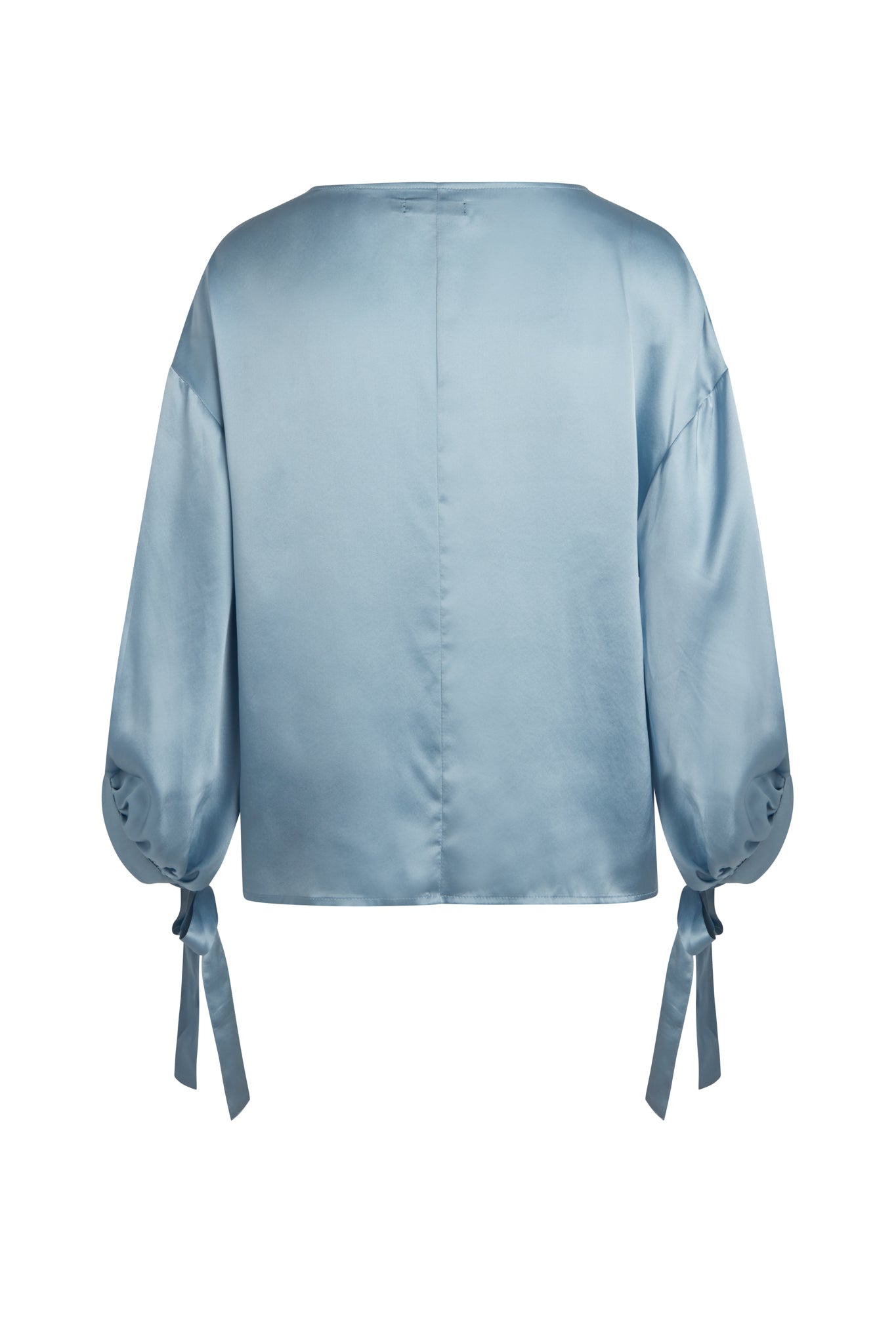 Back view of a periwinkle Catherine Gee Constance Blouse with long sleeves and tie details at the cuffs.
