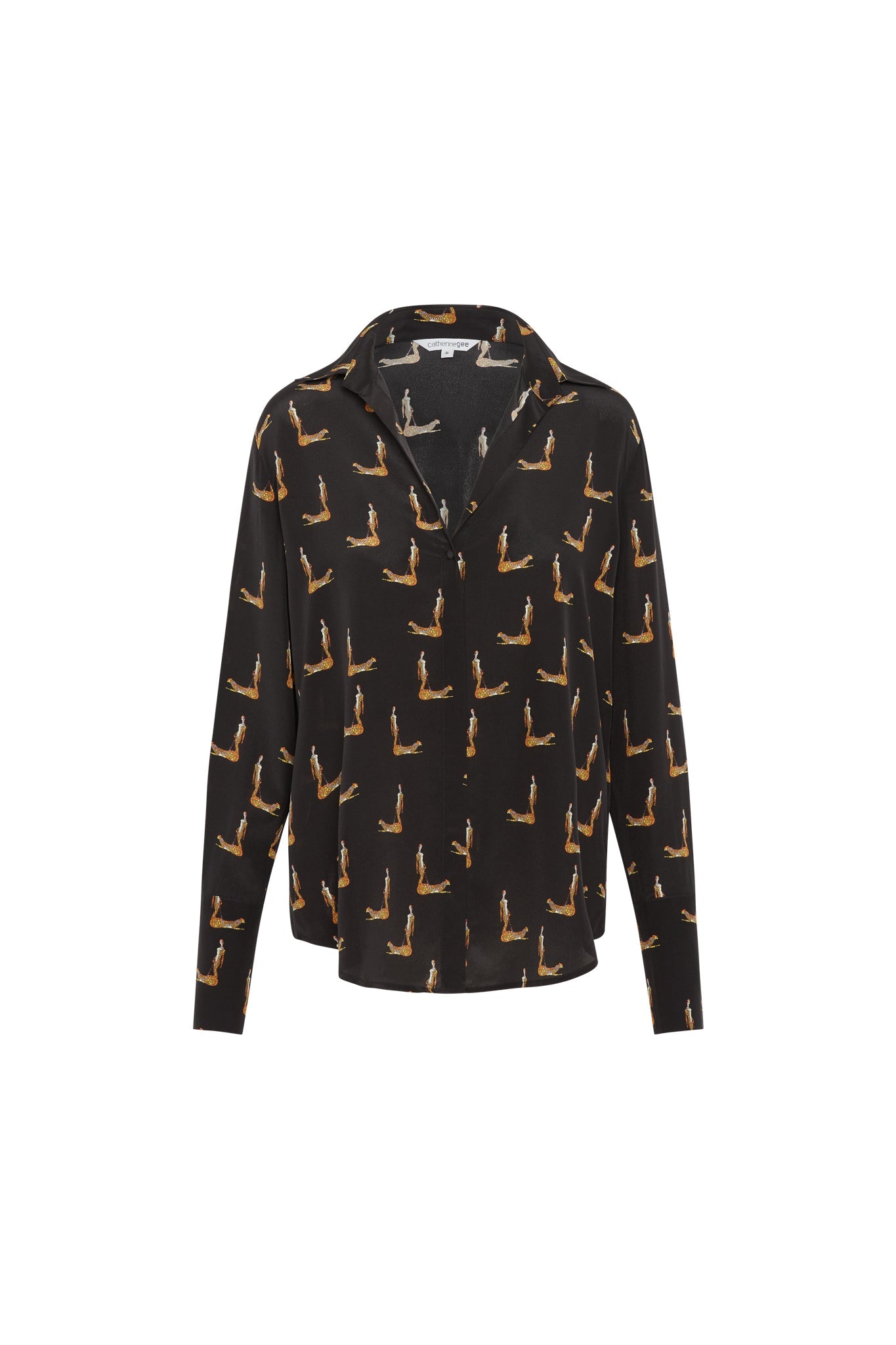 Catherine Gee Daria French Cuff Silk Blouse Catwoman. A black silk blouse with a pattern of a woman in a cat-like pose, designed by Catherine Gee features a classic collar, long sleeves, and French cuffs. The pattern is repeated uniformly across the fabric, giving it a unique and stylish appearance.