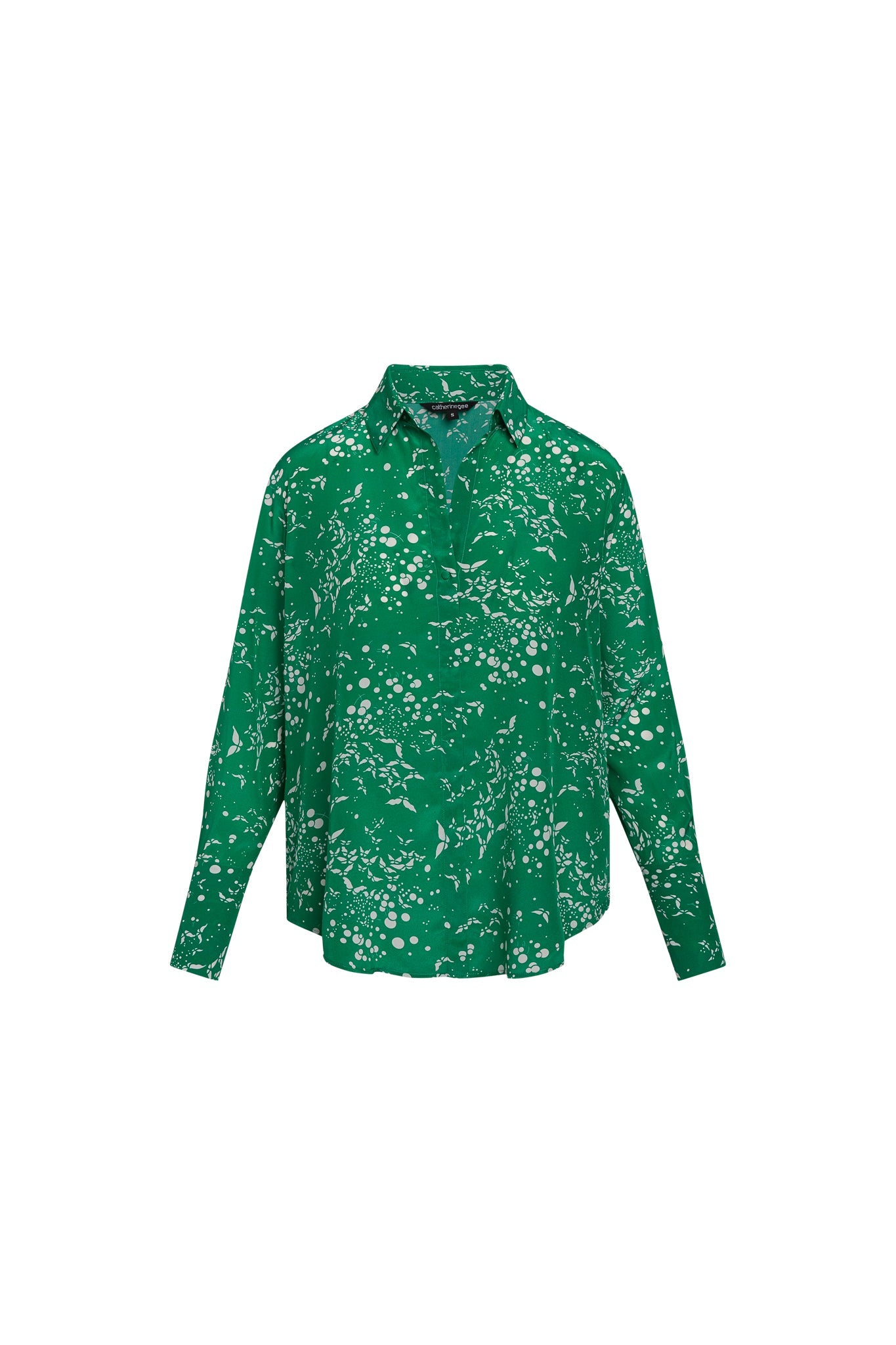 Catherine Gee Daria French Cuff Silk - Celestial Butterfly blouse is green with a white abstract pattern, featuring a classic collar, long sleeves with French cuffs, and a relaxed fit.