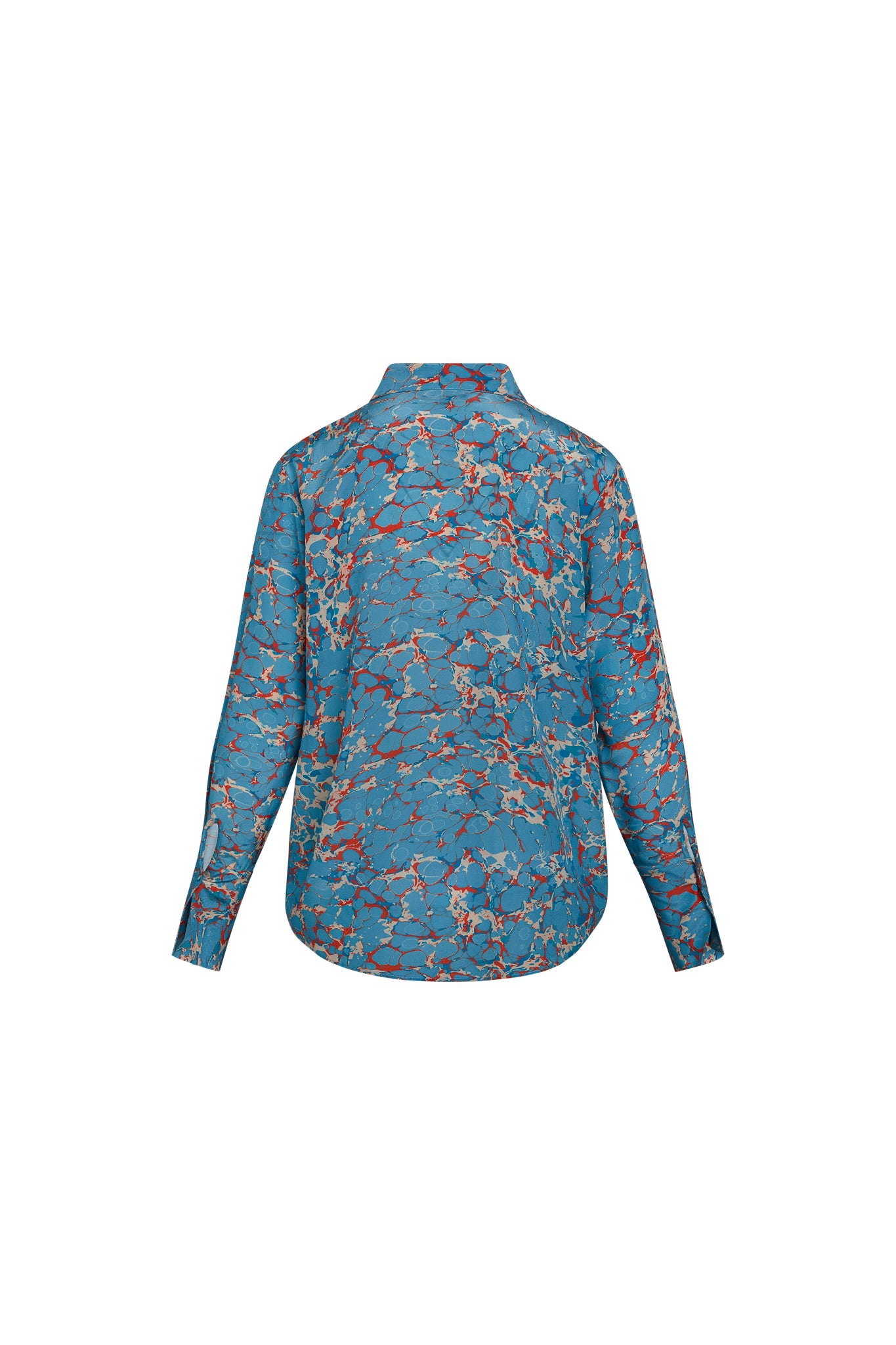 Back view of a Catherine Gee Daria French Cuff Silk Blouse Corfu. The blouse features a blue base with an intricate pattern of red, white, and beige marbling. It has long sleeves with French cuffs and a classic collar.
