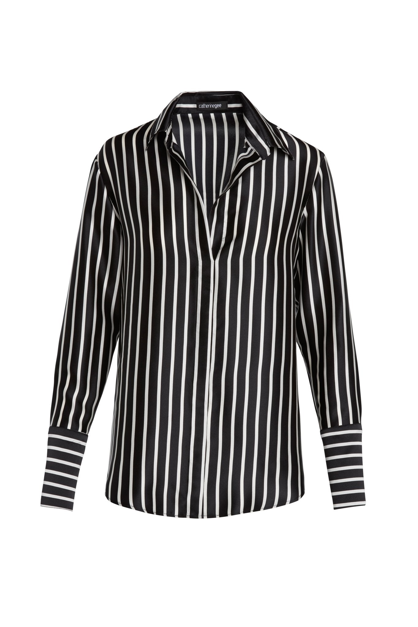 Catherine Gee Daria French Cuff Silk black and white stripes blouse features vertical black and white stripes, a classic collar, and French cuffs with horizontal stripes. The fabric appears to be smooth and silky, giving it a luxurious look.