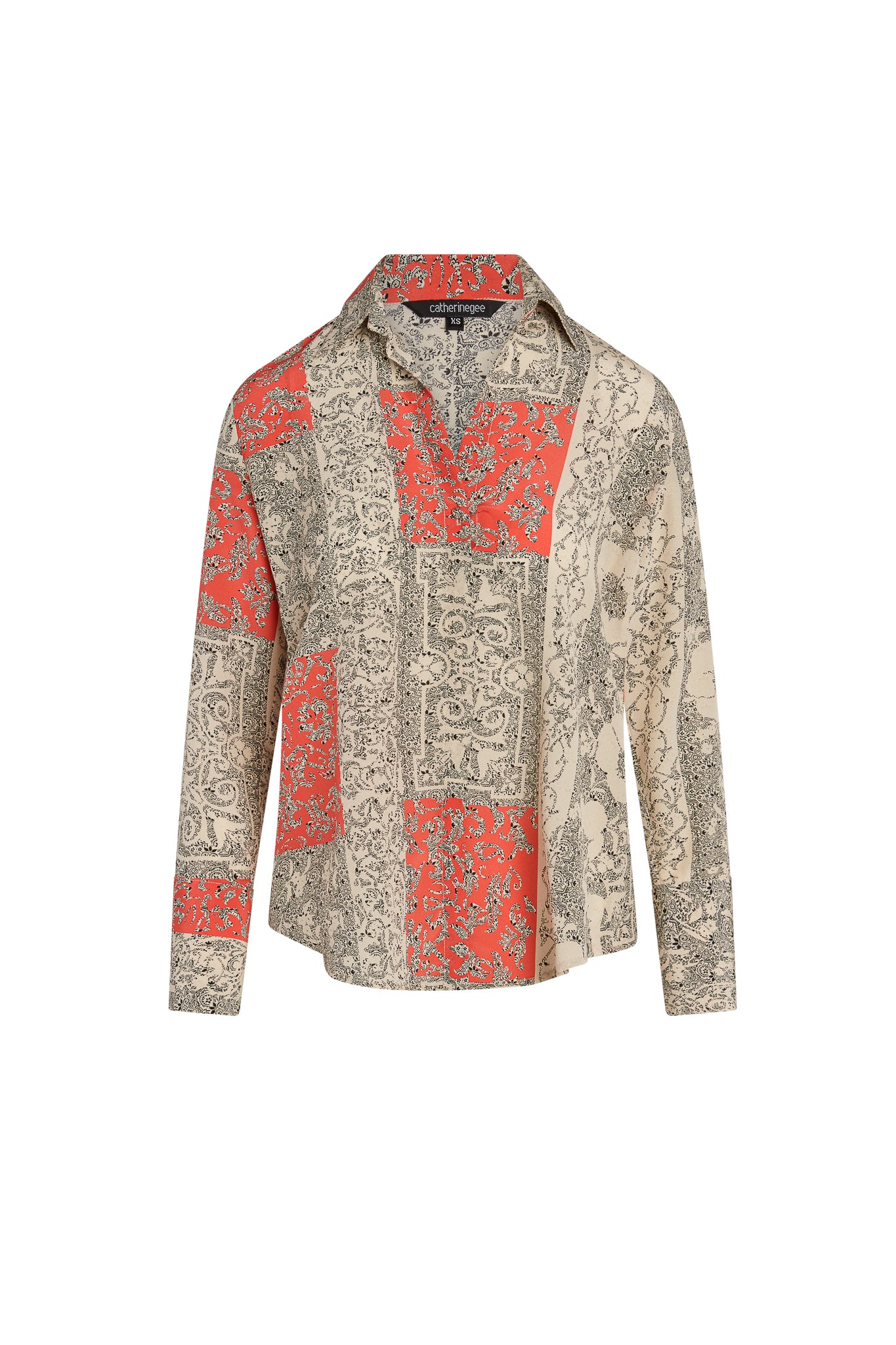 Catherine Gee Daria French Cuff Silk Blouse Capri features a patchwork of red and beige sections with floral and abstract black patterns. The blouse has a collar, long sleeves, and a relaxed fit.