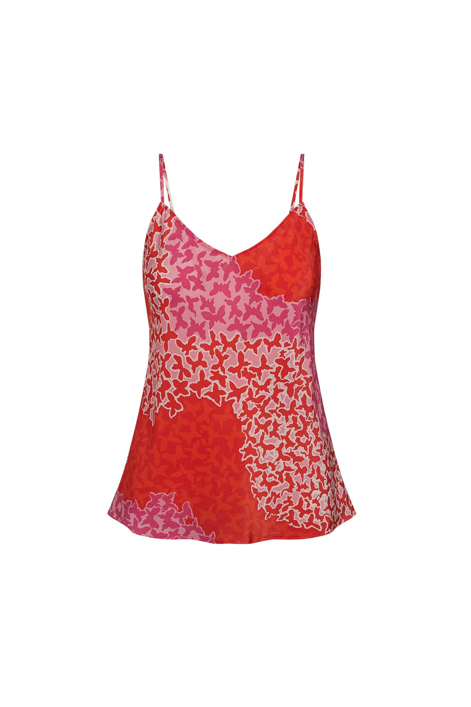 A Catherine Gee Basic Cami - Mariposa features a vibrant pattern of orange, pink, and white star-like shapes. It has thin spaghetti straps and a slightly flared hem.