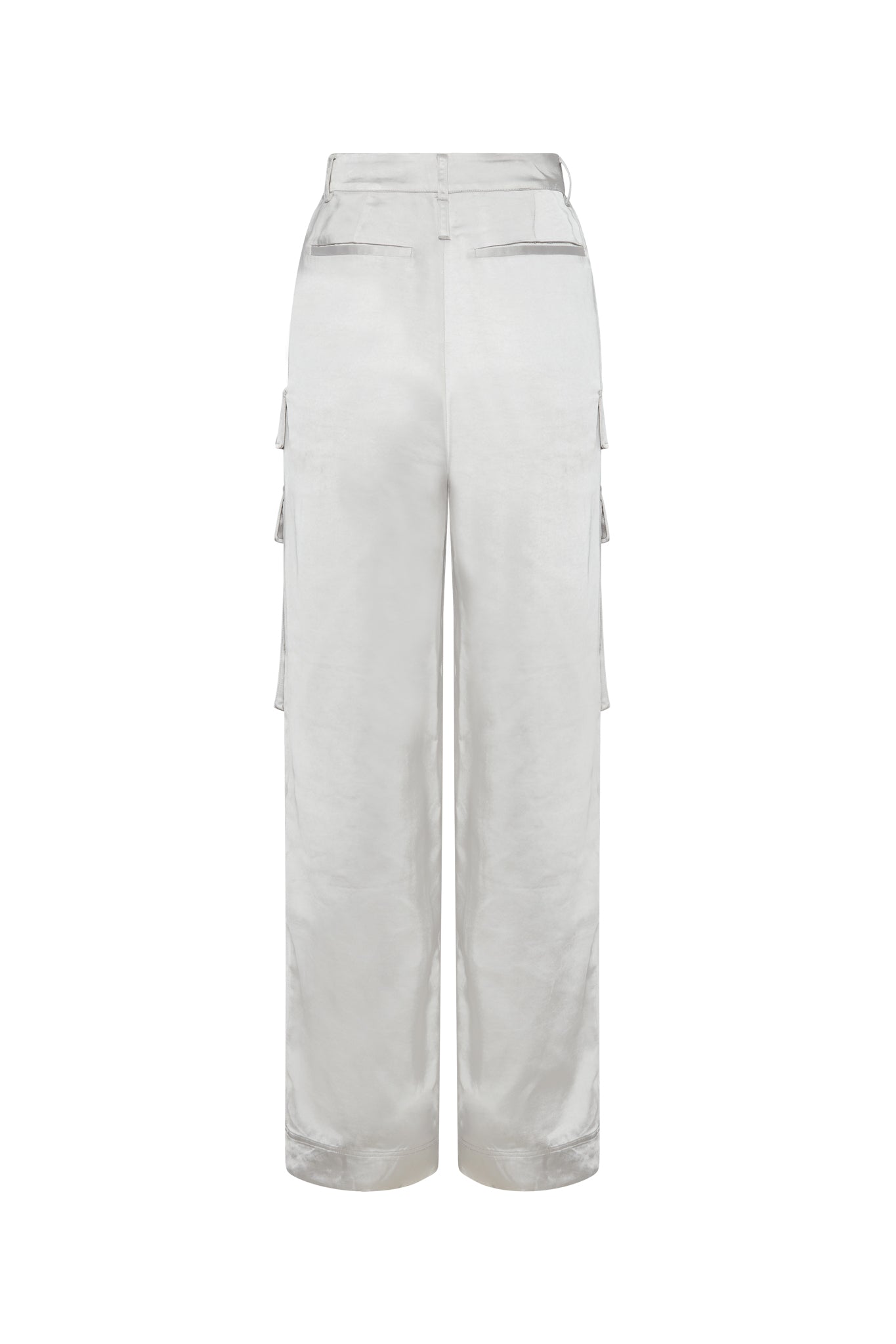 A pair of Catherine Gee Cargo White Pants is shown from the back. The pants are high-waisted with a straight-leg fit and feature multiple pockets, including two flap pockets on the back and cargo pockets on the sides. The fabric appears to be smooth and slightly shiny, giving the pants a sleek and stylish look.