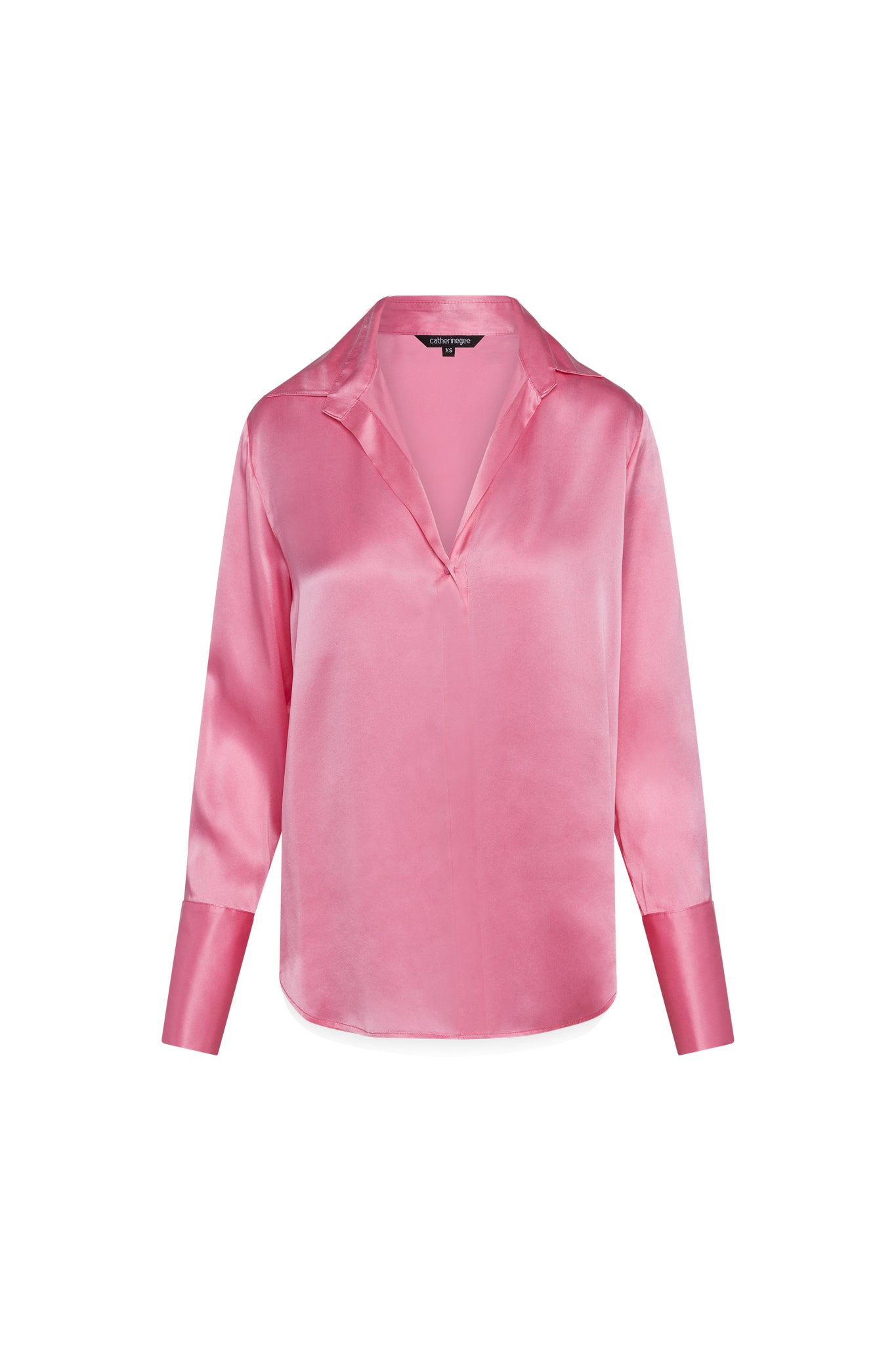 Catherine Gee Daria French Cuff Silk Blouse Doll Pink features a luxurious silk fabric with a soft sheen, a V-neckline with a collar, and long sleeves with French cuffs. The design is elegant and sophisticated, suitable for both professional and casual settings.