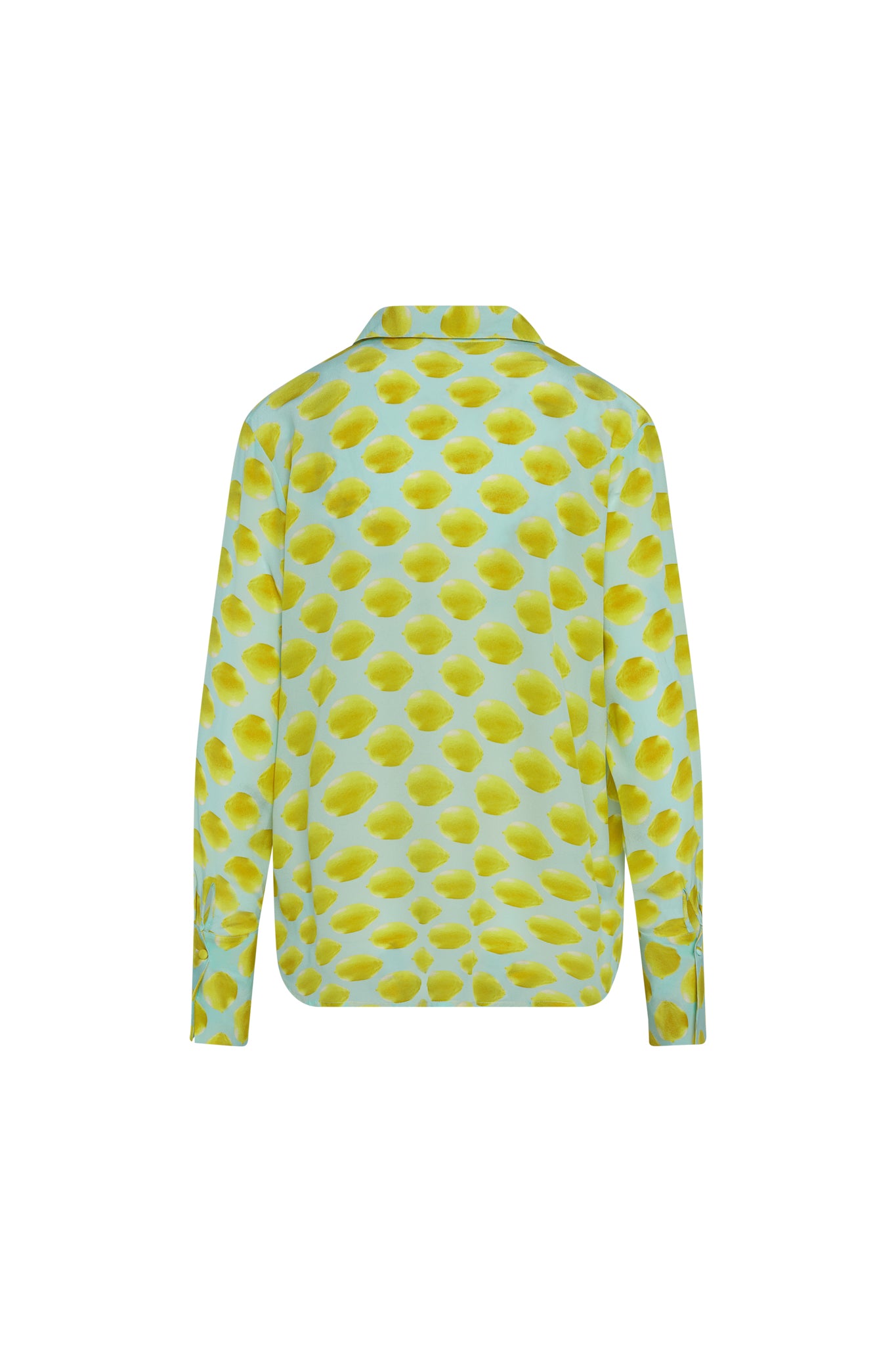 Back-view of a Catherine Gee Daria French Cuff Silk Limon Blue blouse features a light blue background with a pattern of yellow lemon-like spots. It has long sleeves with French cuffs and a classic collar.