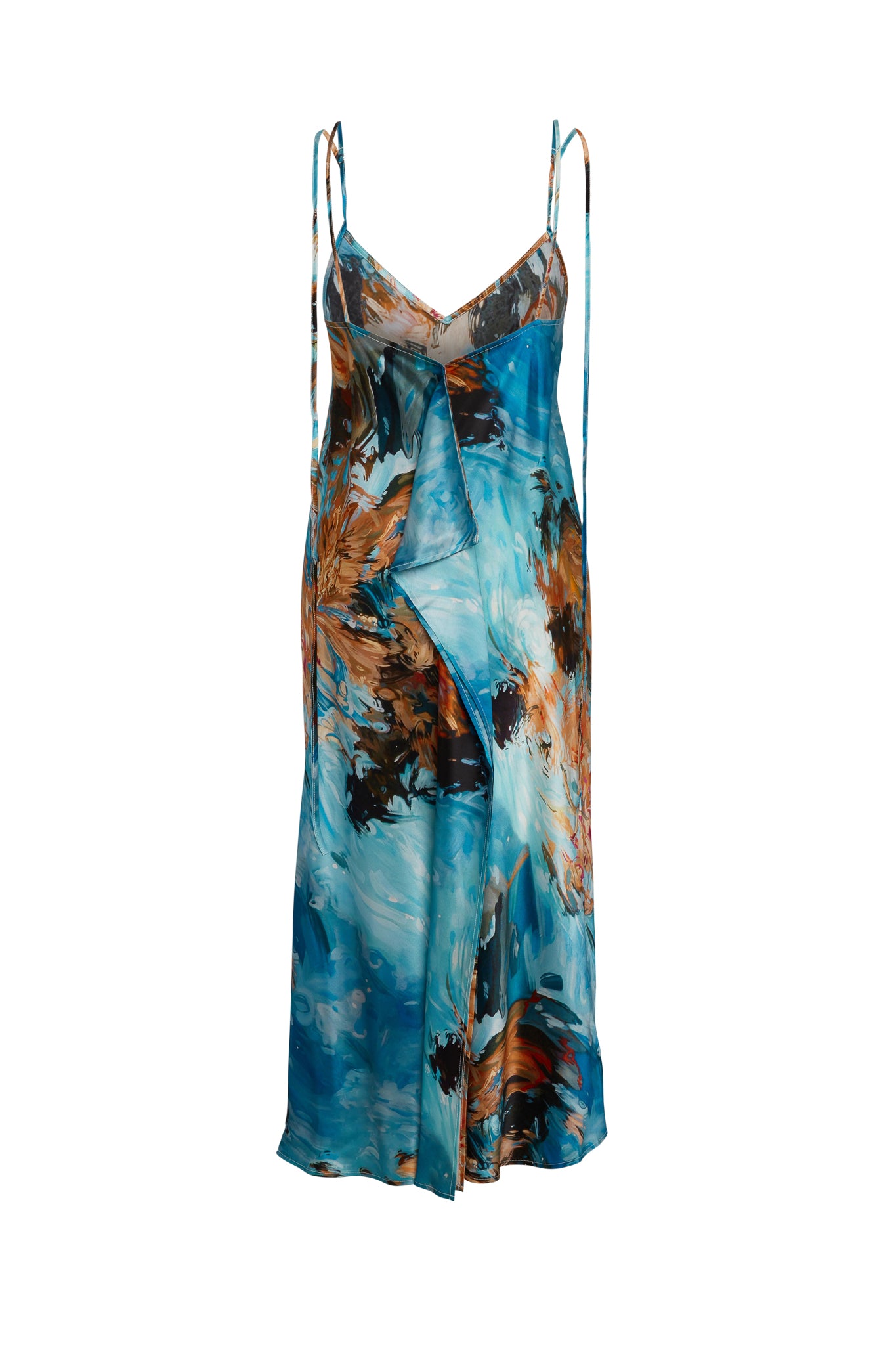 Back-view of Catherine Gee Emma 7 Girls Slip dress features a vibrant, abstract print with a mix of turquoise, orange, and black colors. It has a V-neckline and thin spaghetti straps, giving it a delicate and elegant look. The fabric appears to be lightweight and flowy, making it suitable for warm weather or casual occasions. The dress has a relaxed fit, enhancing its comfortable and stylish appeal.