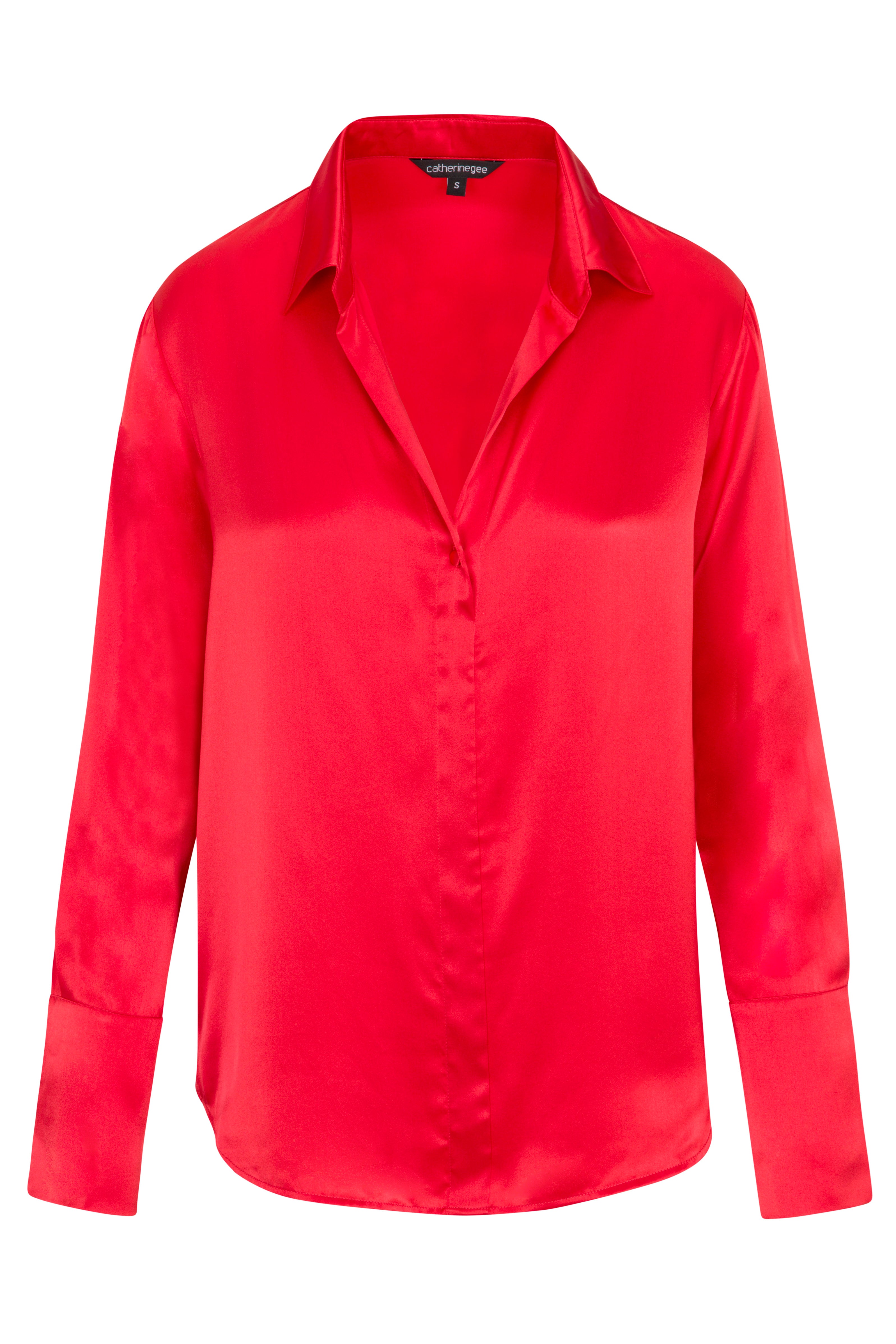 Catherine Gee Daria French Cuff Silk Blouse High-Risk Red. A vibrant red silk blouse with a classic collar and French cuffs, designed by Catherine Gee. The blouse features a smooth, shiny texture and a relaxed fit, making it a stylish and elegant choice for various occasions.