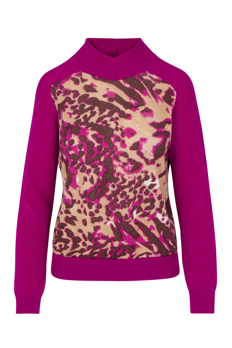 Catherine Gee Gwen Color Block Cashmere Fuchsia Feline sweater features a vibrant fuchsia color on the sleeves, collar, and hem, with a striking animal print pattern in shades of pink, brown, and beige on the front panel. The combination of bold colors and the eye-catching feline print makes it a standout piece, perfect for adding a pop of color and style to any wardrobe.