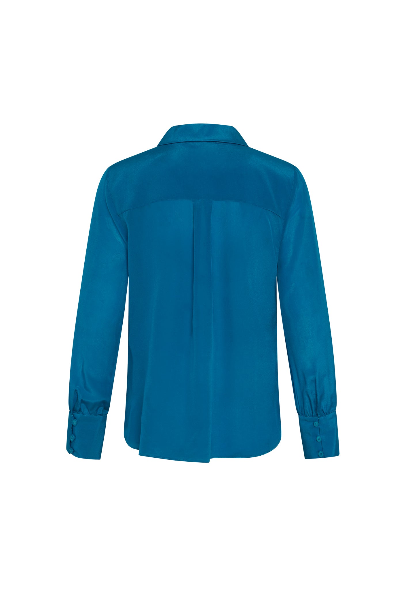 Back-view of a Catherine Gee Jamie True Blue Blouse. This vibrant blue blouse features long sleeves with buttoned cuffs, a pleat down the center of the back, and a yoke across the shoulders. The fabric appears smooth and slightly shiny, indicating high quality. The elegant design makes it suitable for both professional and casual settings, offering a stylish and polished look.