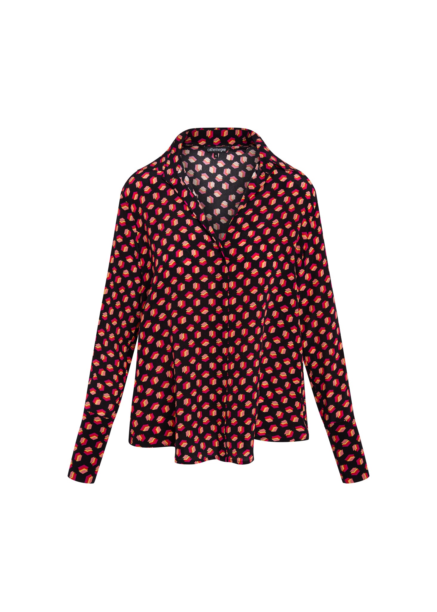Catherine Gee Daria French Cuff Silk-Libros Print blouse features a dark background with a pattern of small, red, book-like shapes. It has a collared neckline and long sleeves with French cuffs.