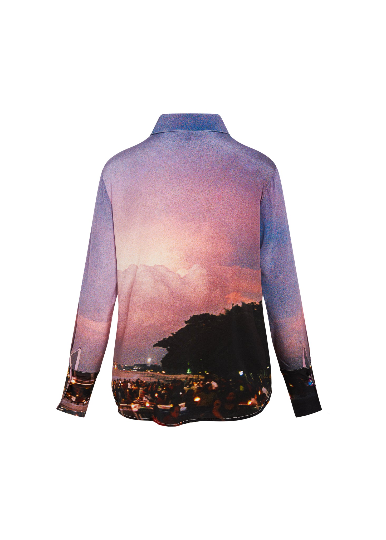Back-view of a Catherine Gee Daria French Cuff Silk Bali Blouse showcases a scenic sunset with a silhouette of trees and a lively evening scene at the bottom, blending vibrant colors of pink, purple, and dark hues.