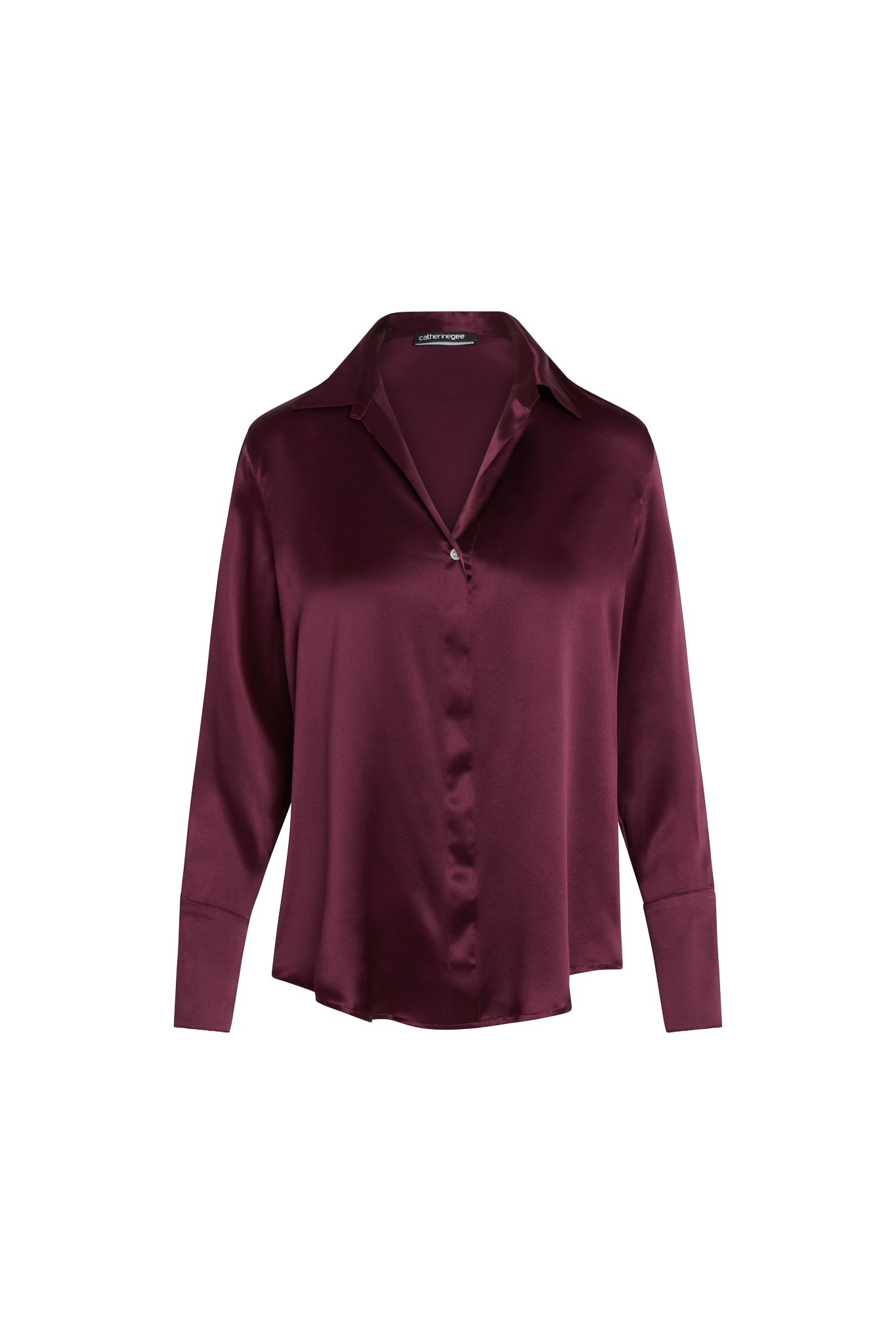 Catherine Gee Daria French Cuff Silk Wine blouse made from luxurious silk fabric in a rich wine color. It features a classic collar, a hidden button placket, and French cuffs, adding a sophisticated touch, and has a relaxed fit, making it both stylish and comfortable, suitable for both professional and casual settings.