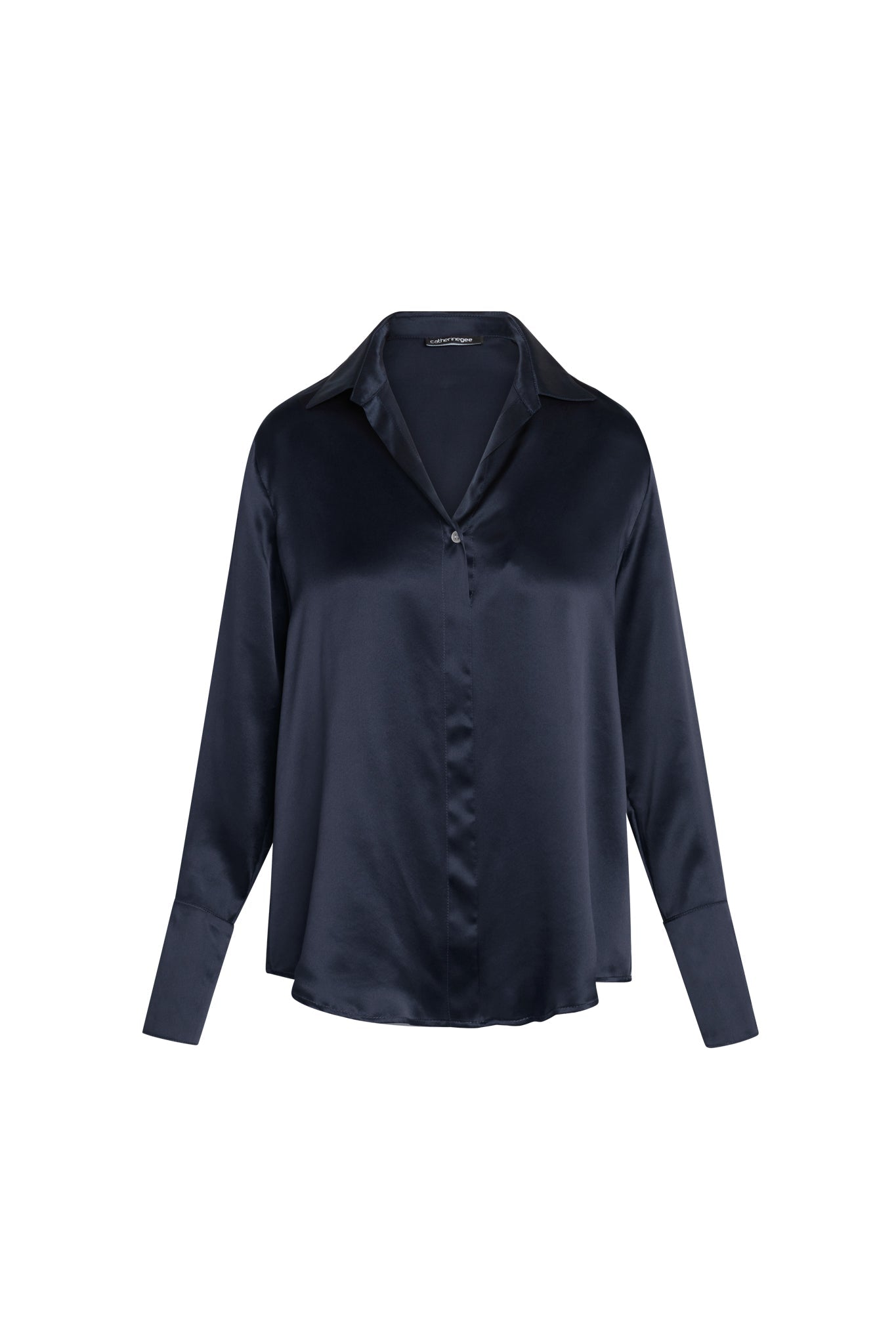 Catherine Gee Daria French Cuff Silk-Midnight Navy blouse made of smooth, shiny silk fabric in a deep midnight navy color. It features a classic collar, a single button closure at the front, and long sleeves with French cuffs.