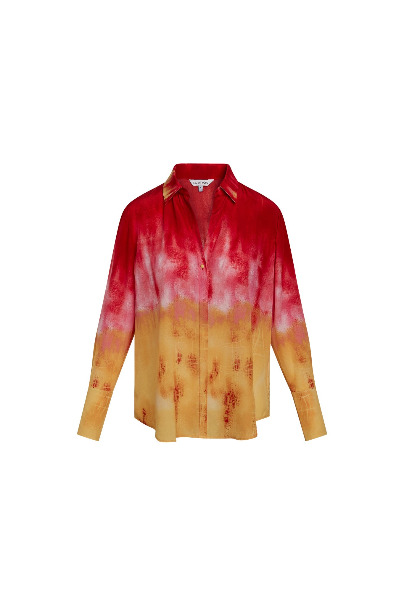Catherine Gee Daria French Cuff Silk Santa Barbara Sunset blouse features a vibrant gradient design that transitions from deep red at the top to warm yellow at the bottom, reminiscent of a sunset. It has a classic collar, button-down front, and long sleeves with French cuffs. The luxurious silk material gives it an elegant appearance, making it a standout piece for any wardrobe.