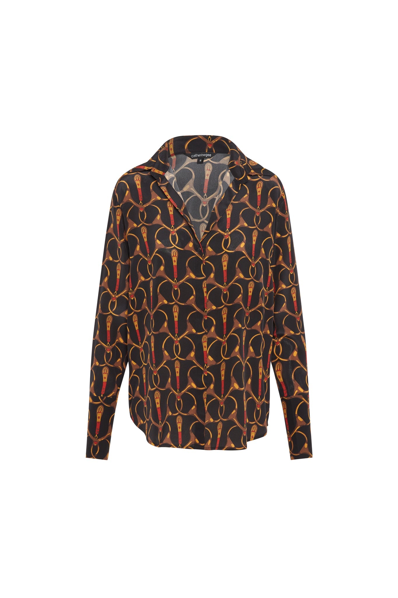 Catherine Gee Daria French Cuff Silk - Buenos Aires Blouse features a black background with an intricate pattern of interlocking gold and red loops. The blouse has a classic collar and long sleeves with French cuffs. The fabric appears to be lightweight and silky, giving it a luxurious and elegant look.