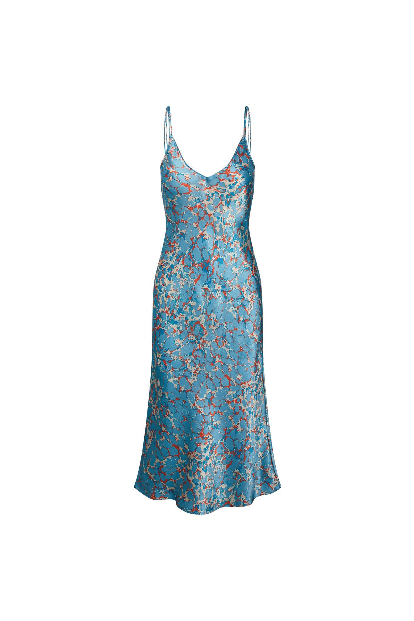 Catherine Gee Emma Corfu Slip Dress is an elegant piece that features delicate spaghetti straps and a deep V-neckline. Made from luxurious, silky fabric, it comes in a vibrant blue color adorned with an intricate floral pattern in shades of red and beige. The dress has a fitted bodice that gently flares out towards the hem, creating a flattering silhouette. It is both stylish and sophisticated, making it suitable for a variety of occasions.