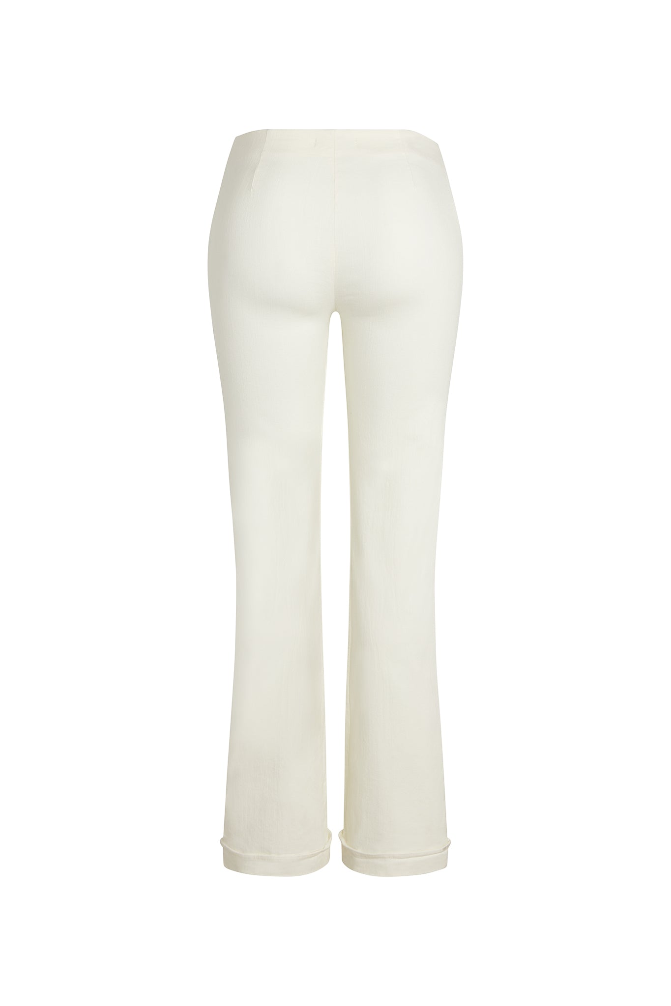 Back-view of Catherine Gee Emma Ivory Twill Denim Trouser. These high-waisted trousers feature a fitted silhouette through the hips and thighs, flaring slightly towards the hem. The soft, ivory-colored twill denim adds a sophisticated and elegant touch. With a clean design and no visible pockets or embellishments, they emphasize a sleek and minimalist style, perfect for any occasion.