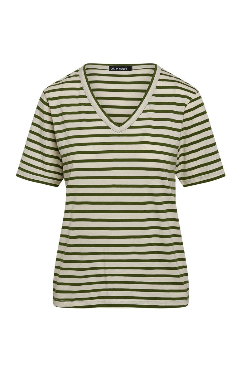Catherine Gee Jen Relaxed Shortsleeve - Green Stripe tee features a V-neck design and short sleeves. The pattern consists of horizontal green and white stripes, creating a casual and stylish look. The fabric appears to be soft and comfortable, making it suitable for everyday wear. The label "Catherine Gee" is visible at the back of the neckline.